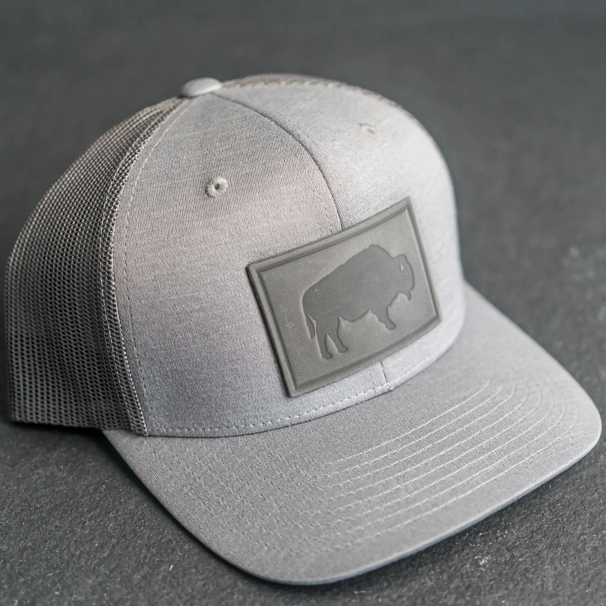 Leather Patch Performance Style Trucker Hat - Bison Stamp