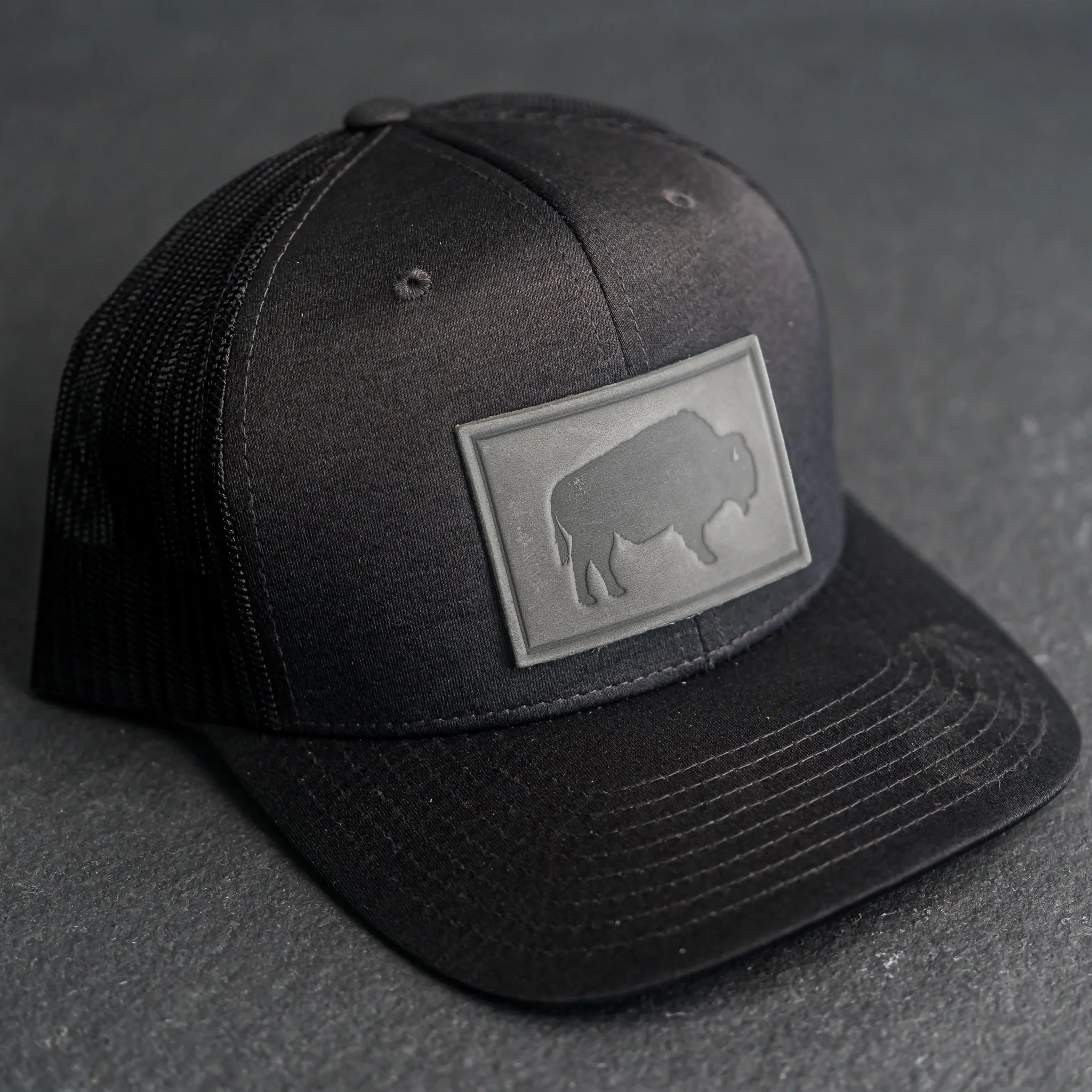 Leather Patch Performance Style Trucker Hat - Bison Stamp