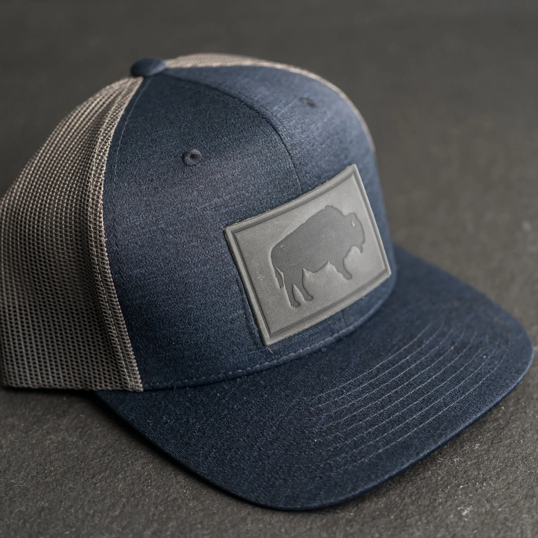 Leather Patch Performance Style Trucker Hat - Bison Stamp